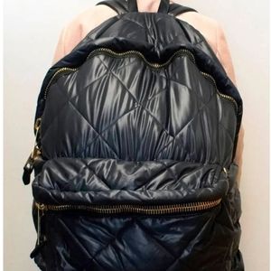 Moschino Pre-Loved quilted oversized backpack.